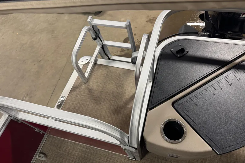 Slide: The Image of 2022 Sun Tracker Bass Buggy 18 DLX pontoon boat deck with ladder and measuring board. - 14