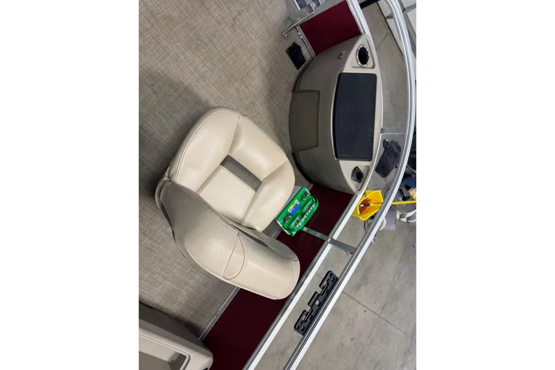 Slide: The Image of Interior of 2022 Sun Tracker Bass Buggy 18 DLX with beige seating and console. - 6