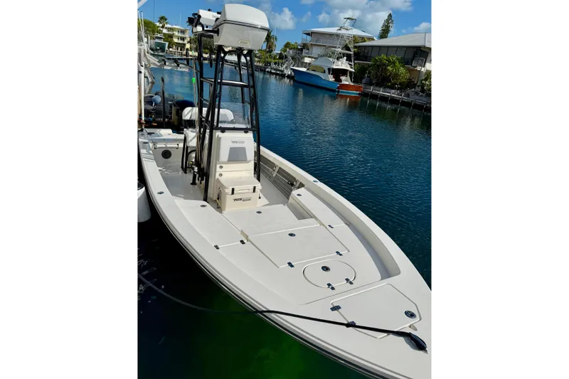The Image of 2021 Pathfinder 2400 TRS boat docked in a serene marina setting. - 0
