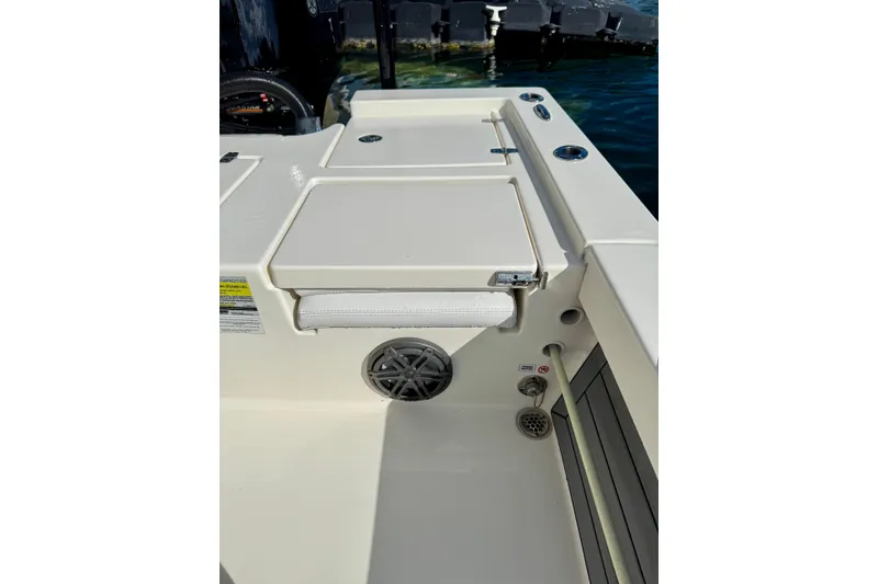 Slide: The Image of 2021 Pathfinder 2400 TRS boat interior with seating and speaker detail. - 13