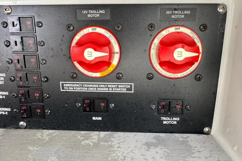 Slide: The Image of Control panel of a 2021 Pathfinder 2400 TRS with switches for 12V and 36V trolling motors. - 14