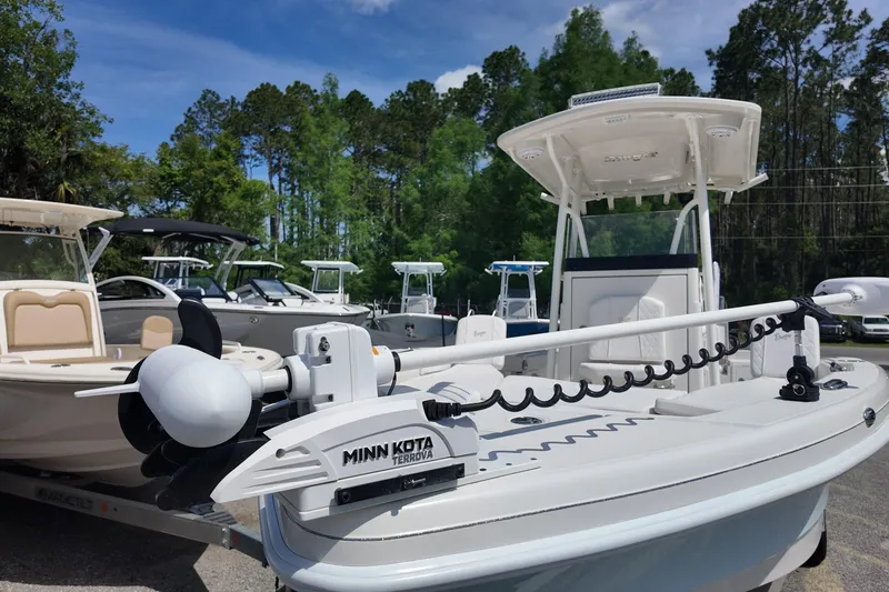 Slide: The Image of 2024 Ranger 2660 Bay boat with Minn Kota Terrova motor, displayed outdoors. - 10