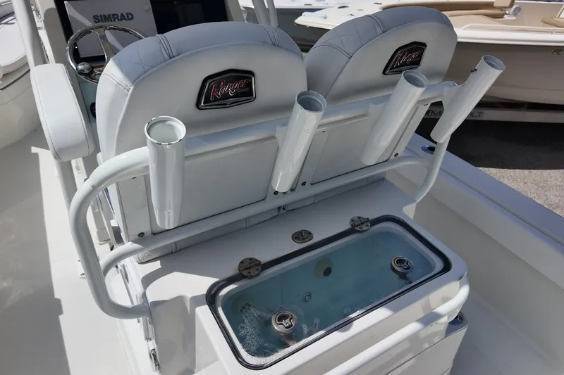 Slide: The Image of 2024 Ranger 2660 Bay boat interior with rod holders and livewell. - 15