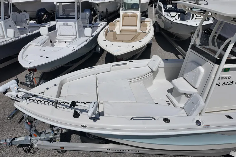 Slide: The Image of 2024 Ranger 2660 Bay boat displayed in a marina, showcasing sleek design and modern features. - 17
