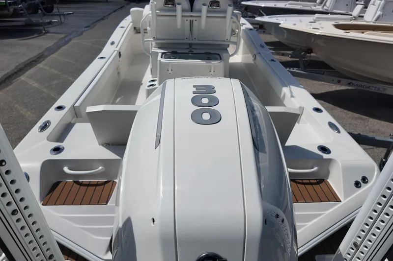 Slide: The Image of 2024 Ranger 2660 Bay boat with powerful 300 HP engine, showcasing sleek design and spacious deck. - 4