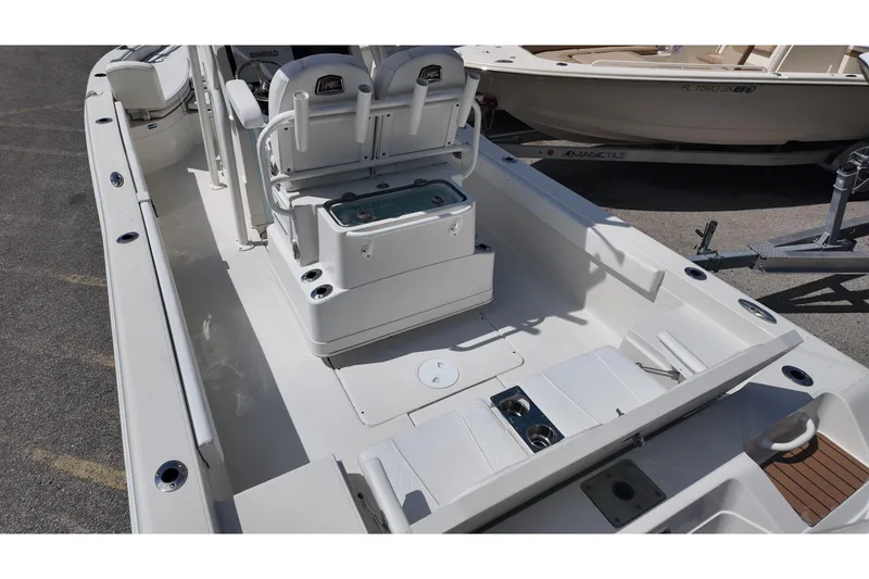 Slide: The Image of 2024 Ranger 2660 Bay boat interior with seating and storage compartments. - 5