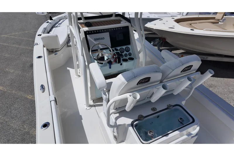 Slide: The Image of 2024 Ranger 2660 Bay boat interior with steering console and seating. - 6