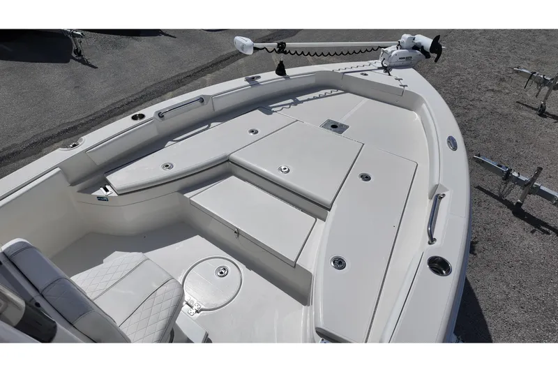 Slide: The Image of 2024 Ranger 2660 Bay boat deck with seating and storage compartments. - 9