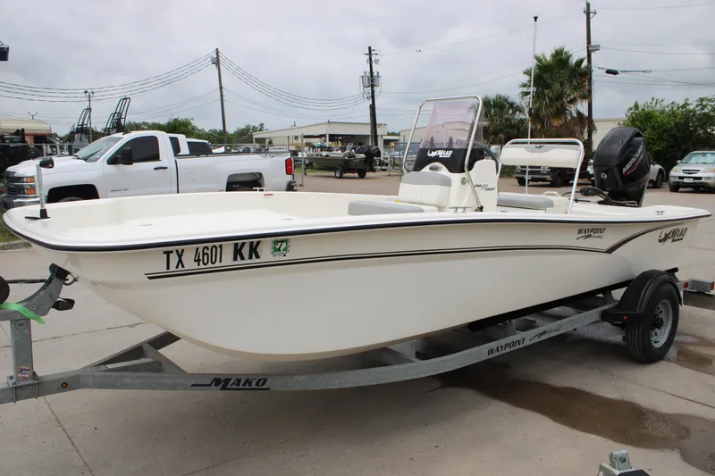Slide: The Image of 2021 Mako Pro Skiff 17 CC boat on trailer, parked outdoors. - 7