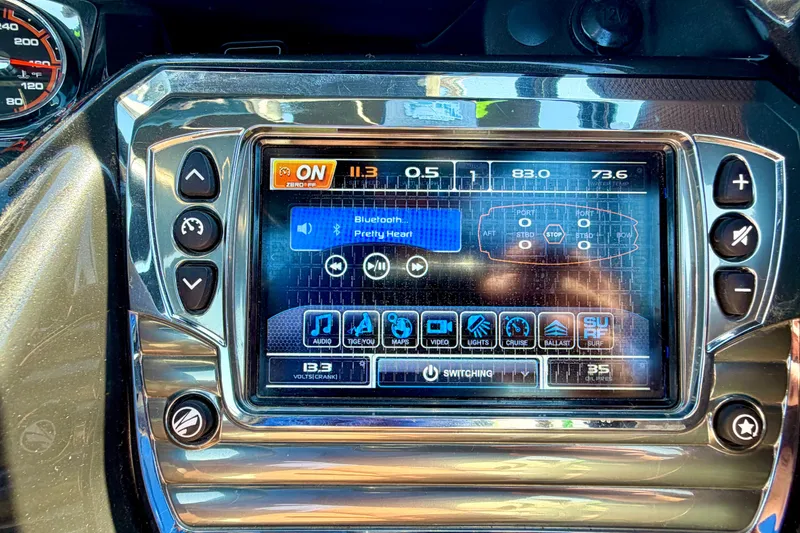 Slide: The Image of Dashboard of a 2016 Tigé RZX3 boat with touchscreen controls and audio display. - 18