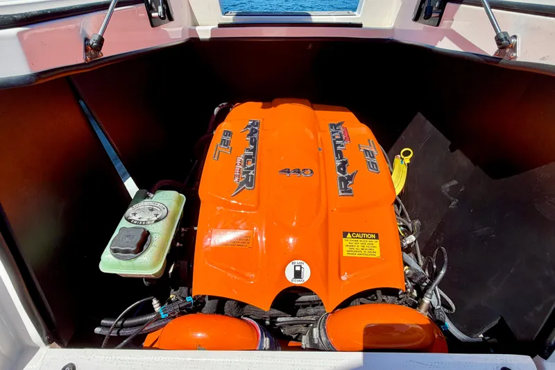 Slide: The Image of 2016 Tigé RZX3 boat engine, Raptor 6.2L, vibrant orange cover. - 19