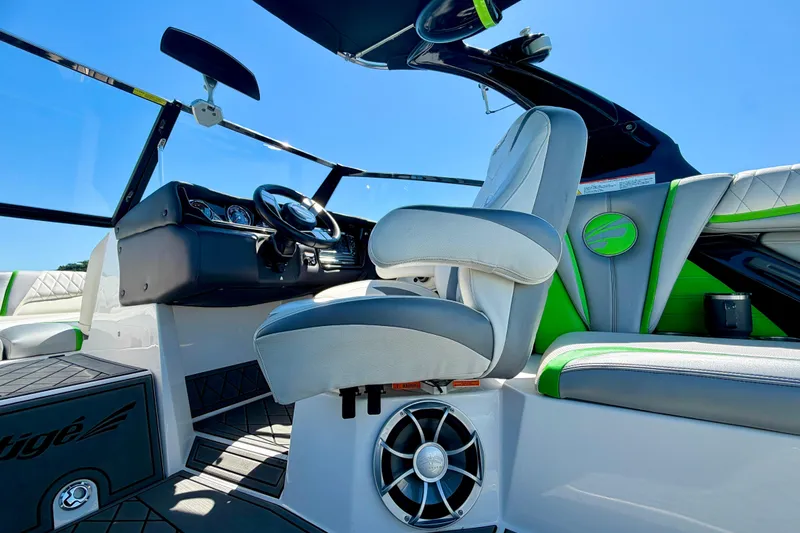 Slide: The Image of 2016 Tigé RZX3 boat interior with modern steering and seating. - 31