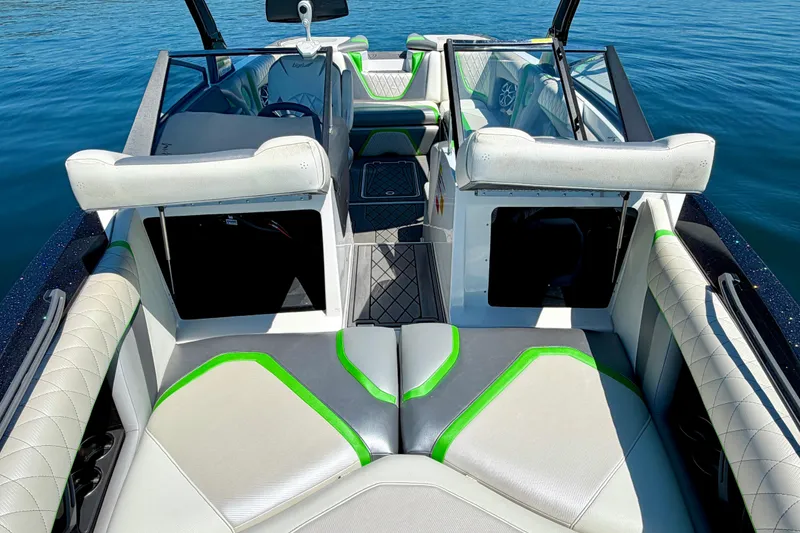 Slide: The Image of 2016 Tigé RZX3 boat interior with stylish seating and modern design on calm water. - 35