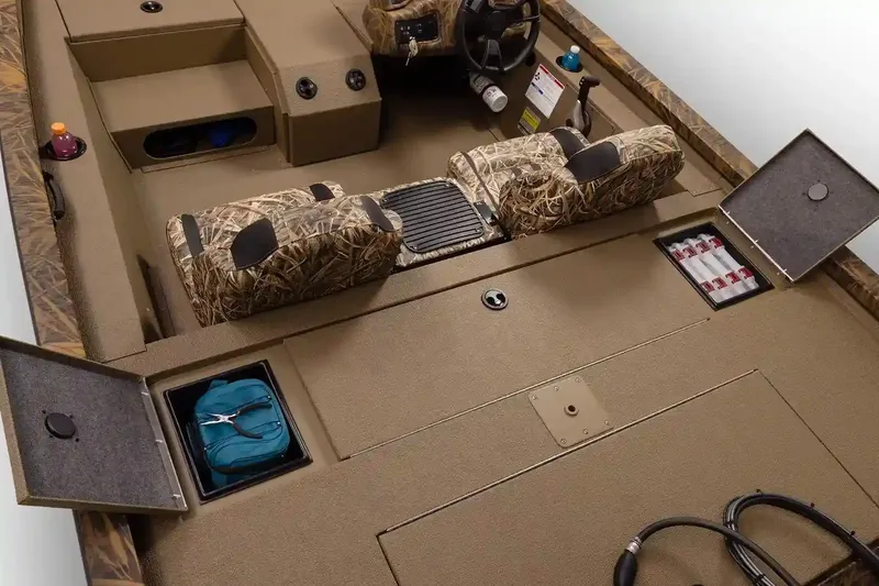 Slide: The Image of Manufacturer Provided Image: 2026 G3 Sportsman 1710 boat interior with camo seats and storage compartments. - 3