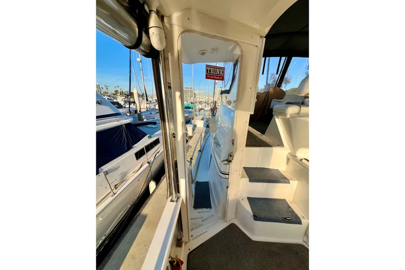 Slide: The Image of 1997 Sea Ray 370 Aft Cabin yacht interior with marina view. - 19
