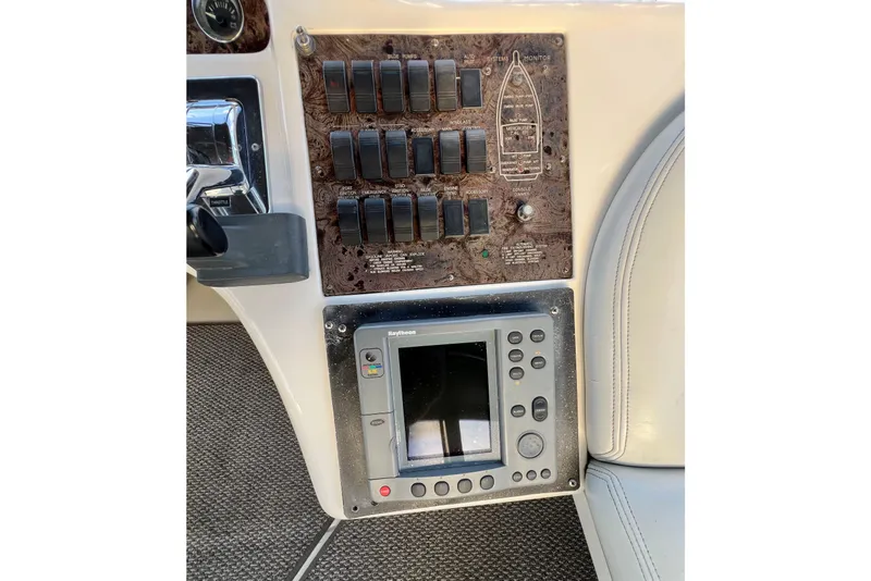 Slide: The Image of Control panel and navigation system of a 1997 Sea Ray 370 Aft Cabin boat. - 25