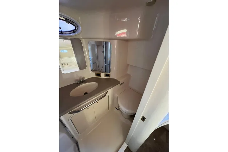 Slide: The Image of Bathroom interior of 1997 Sea Ray 370 Aft Cabin yacht, featuring sink and toilet. - 72