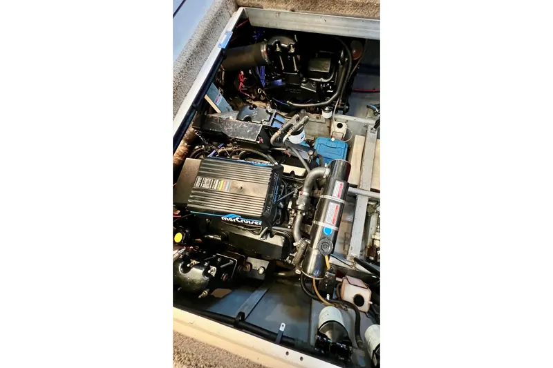 Slide: The Image of Engine compartment of a 1997 Sea Ray 370 Aft Cabin boat, featuring a MerCruiser engine. - 77