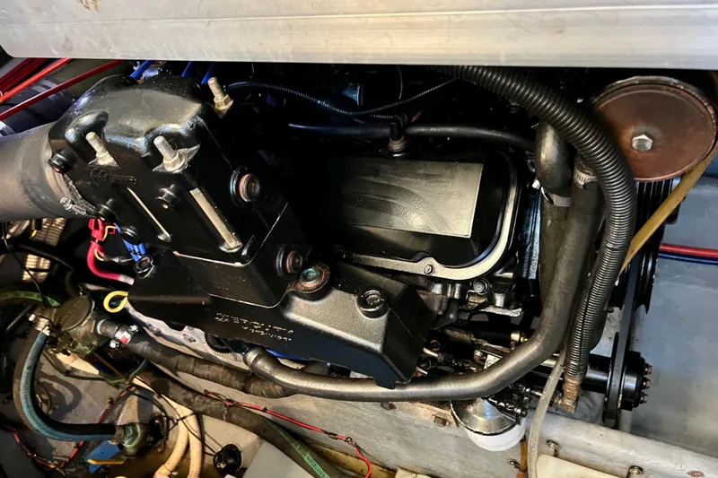 Slide: The Image of Engine compartment of a 1997 Sea Ray 370 Aft Cabin boat, showing detailed components. - 78