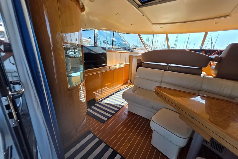 Slide: The Image of Luxurious interior of 2000 Neptunus 56 Express yacht with elegant seating and wood finishes. - 17