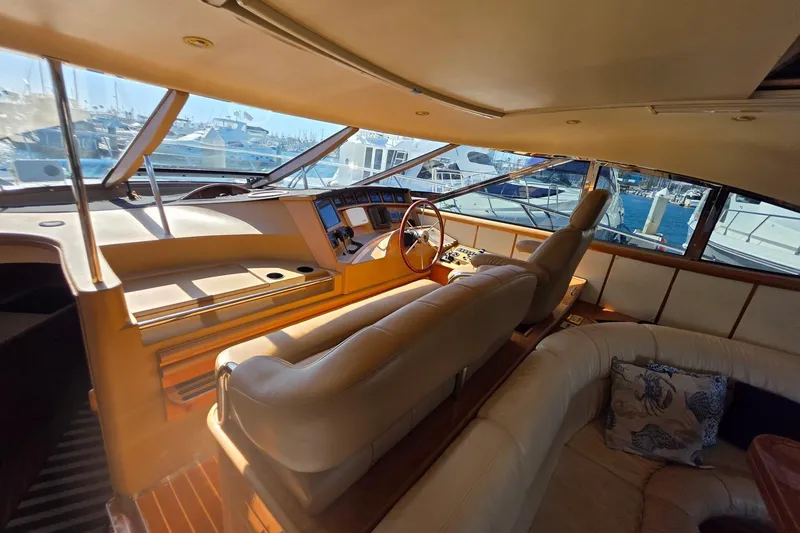 Slide: The Image of Luxurious interior of a 2000 Neptunus 56 Express yacht with plush seating and helm. - 21