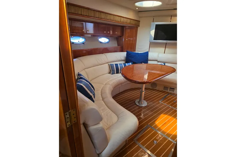 Slide: The Image of Luxurious interior of 2000 Neptunus 56 Express yacht with plush seating and elegant wood finishes. - 22