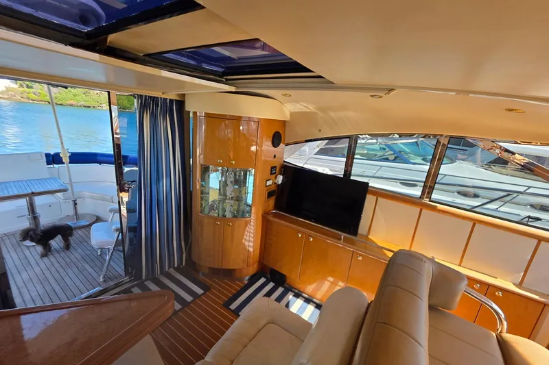 Slide: The Image of Luxurious interior of a 2000 Neptunus 56 Express yacht with elegant wood finishes. - 23