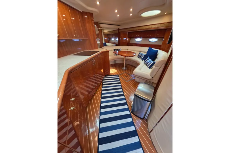 Slide: The Image of Luxurious interior of 2000 Neptunus 56 Express yacht with elegant wood finishes. - 24
