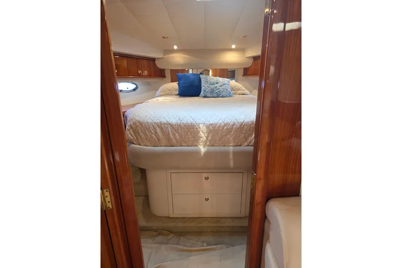 Slide: The Image of Luxurious bedroom interior of 2000 Neptunus 56 Express yacht with elegant bedding. - 26