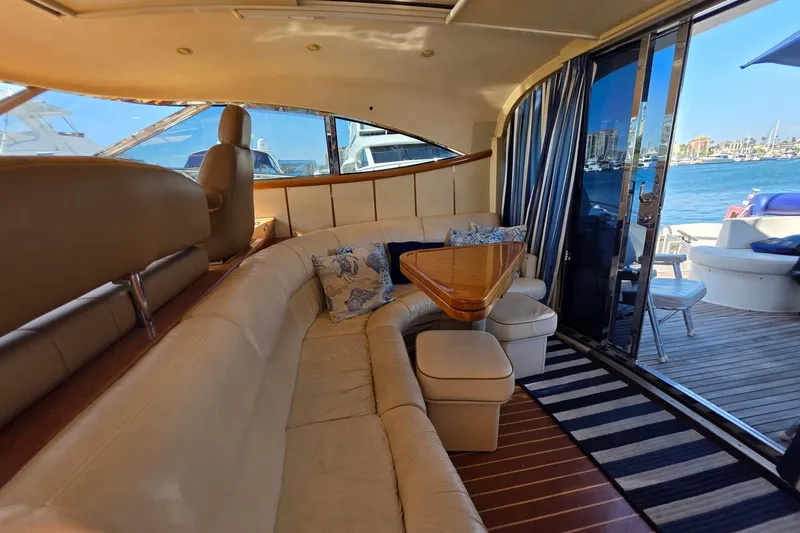 Slide: The Image of Luxurious interior of 2000 Neptunus 56 Express yacht with elegant seating and scenic water view. - 28