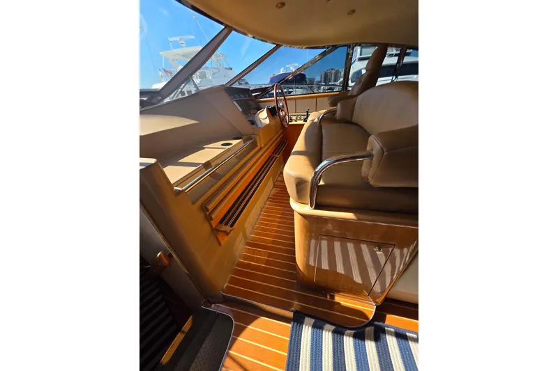 Slide: The Image of Interior of 2000 Neptunus 56 Express yacht with luxurious seating and wooden flooring. - 4
