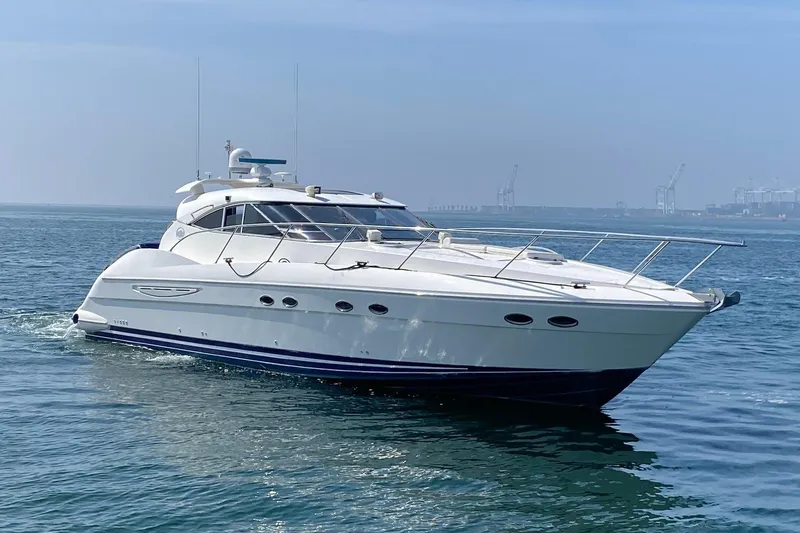 Slide: The Image of 2000 Neptunus 56 Express yacht cruising on calm blue waters under a clear sky. - 0