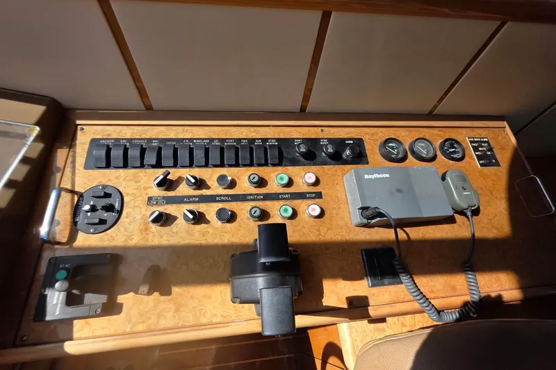 Slide: The Image of Control panel of a 2000 Neptunus 56 Express yacht with various switches and gauges. - 7