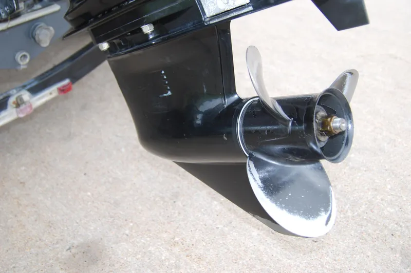 Slide: The Image of 2015 Tracker Pro Guide V-16 SC boat propeller, close-up view on concrete surface. - 10