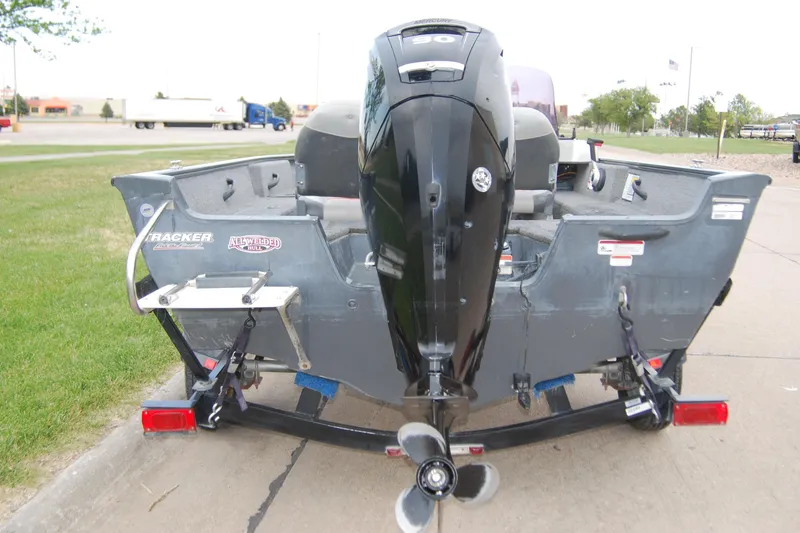 Slide: The Image of 2015 Tracker Pro Guide V-16 SC boat with outboard motor, rear view. - 9