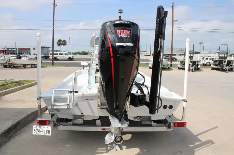 Slide: The Image of 2023 Shoalwater 19' Catamaran with Mercury 115 outboard motor on trailer. - 10
