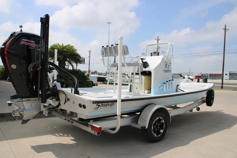 Slide: The Image of 2023 Shoalwater 19' Catamaran on trailer with Mercury Pro XS outboard motor. - 11