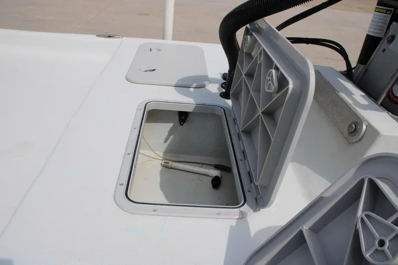 Slide: The Image of Open storage compartment on 2023 Shoalwater 19' Catamaran boat deck. - 12