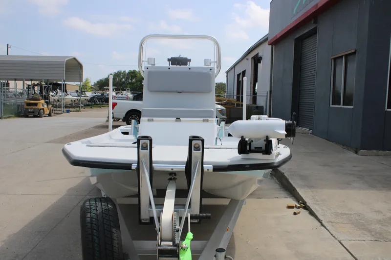 Slide: The Image of 2023 Shoalwater 19' Catamaran on trailer outside a warehouse. - 8