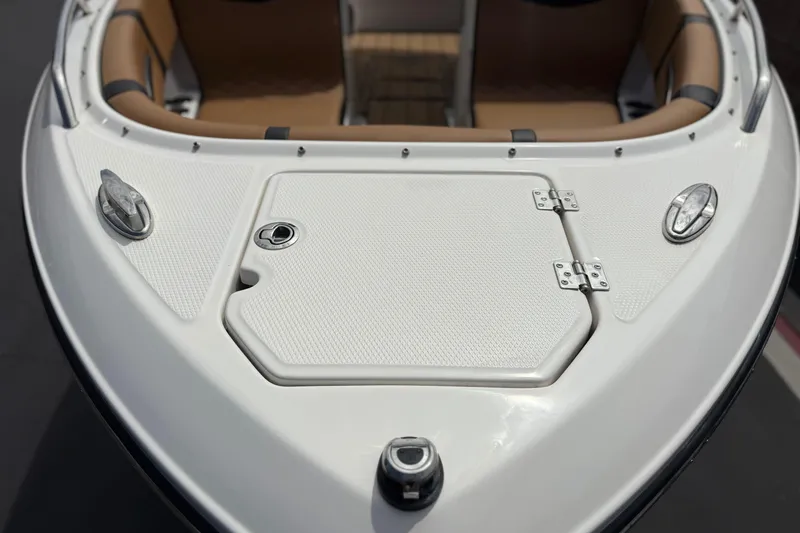 Slide: The Image of 2024 Chaparral 247 SSX boat bow with storage hatch and seating. - 12