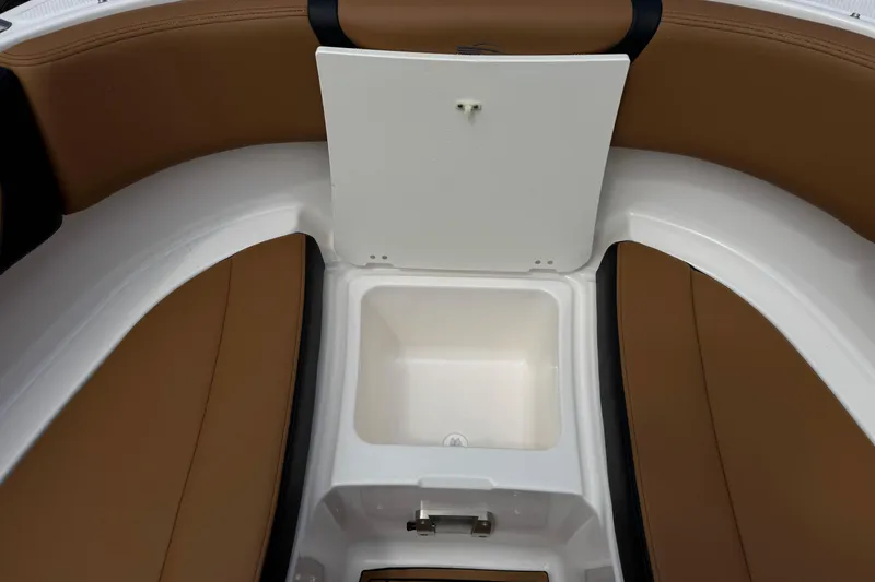 Slide: The Image of 2024 Chaparral 247 SSX boat interior with open storage compartment. - 19
