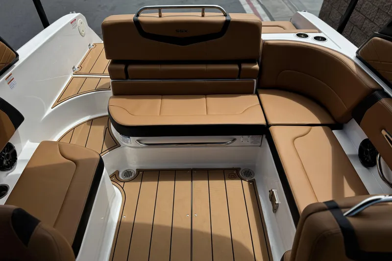 Slide: The Image of Luxurious interior of 2024 Chaparral 247 SSX boat with tan seating and sleek design. - 25