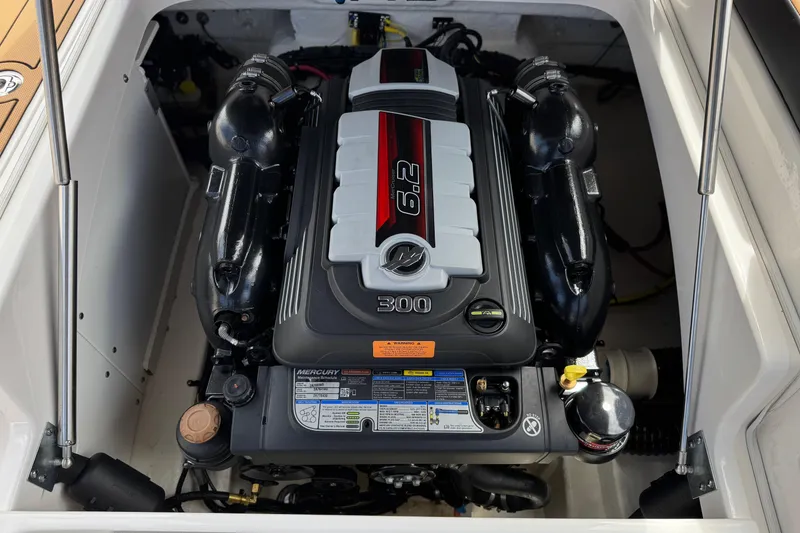 Slide: The Image of 2024 Chaparral 247 SSX boat engine compartment with Mercury 6.2L 300 HP engine. - 27