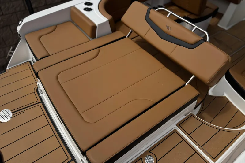 Slide: The Image of 2024 Chaparral 247 SSX boat with luxurious tan seating and sleek design. - 28