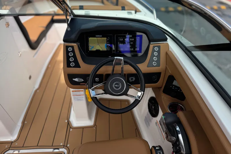 Slide: The Image of 2024 Chaparral 247 SSX boat dashboard with modern controls and navigation display. - 34