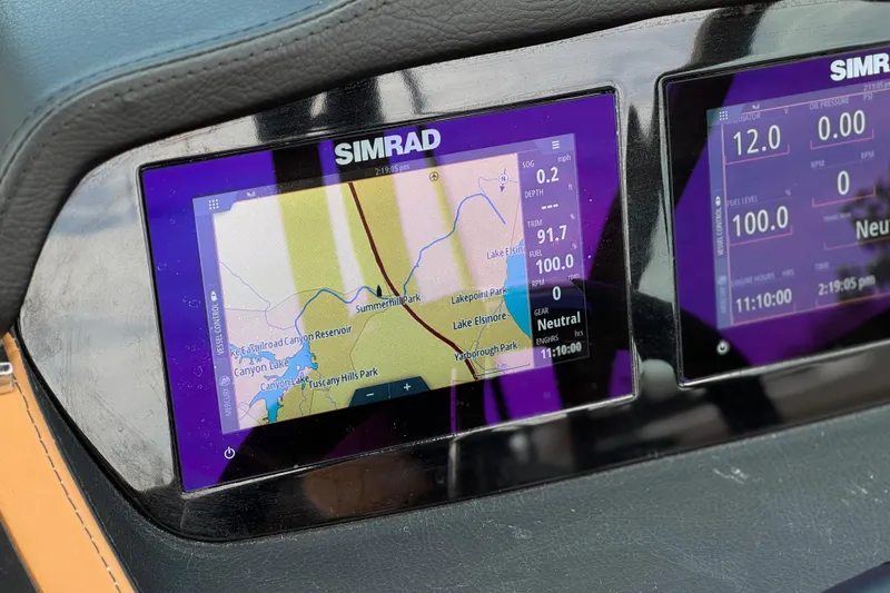 Slide: The Image of Simrad navigation display on 2024 Chaparral 247 SSX boat dashboard. - 35