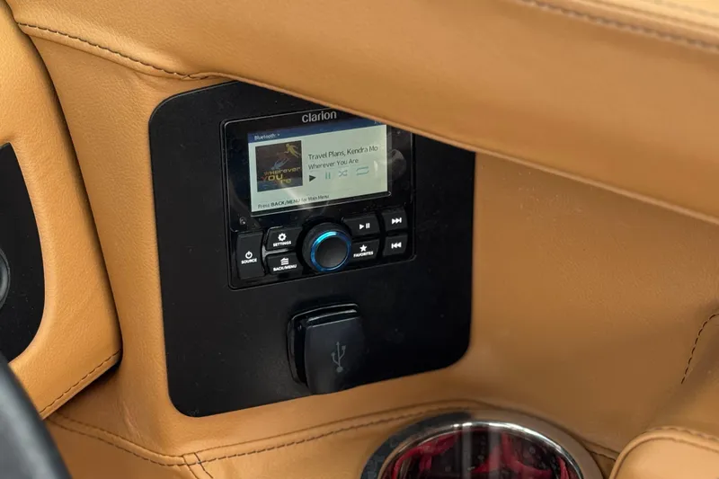 Slide: The Image of 2024 Chaparral 247 SSX boat interior featuring a Clarion audio system and USB port. - 37