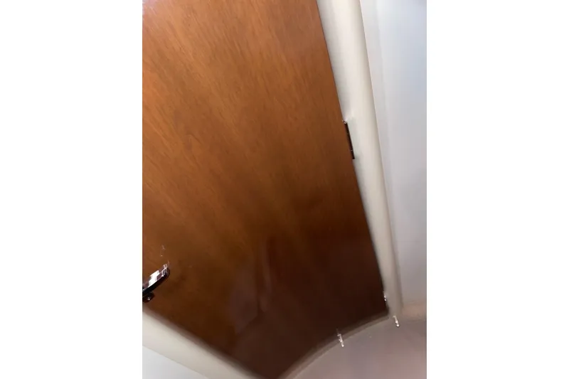 Slide: The Image of Wooden door inside a 2007 Carver 360 Mariner yacht, showcasing interior design. - 14