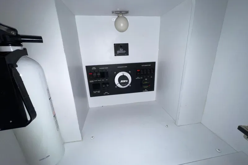 Slide: The Image of Control panel of a 2007 Carver 360 Mariner boat with fire extinguisher. - 15