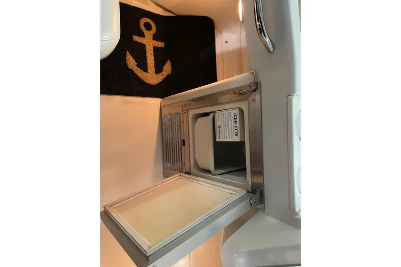 Slide: The Image of Open ice maker on 2007 Carver 360 Mariner boat, with anchor-themed mat nearby. - 27